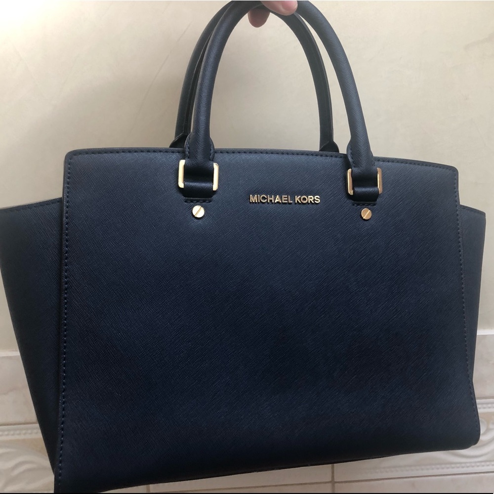 navy blue SELMA SATCHEL MK bag.